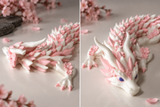 ZUZUI gelede draak tussen kersenbloesems, wit en roze verzamelfiguur van 46 cm